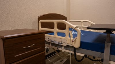 Comfortable resident room with hospital bed