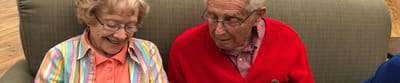 Two residents enjoying time together in a common area