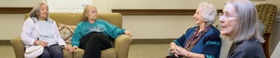 Residents engaging in conversation in a common area