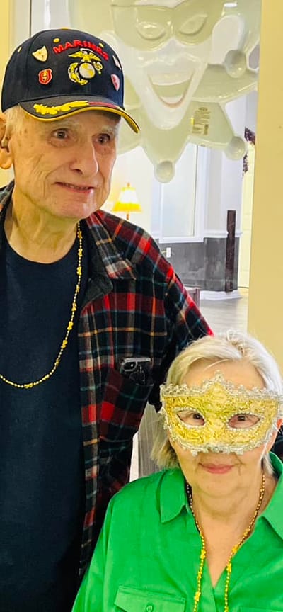 Residents celebrating with decorations and costumes in a common area