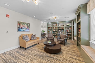 Cozy common area with seating and bookshelves
