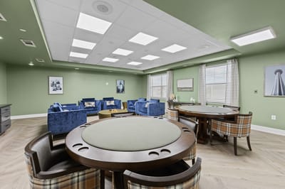 Interior common area with seating and game tables
