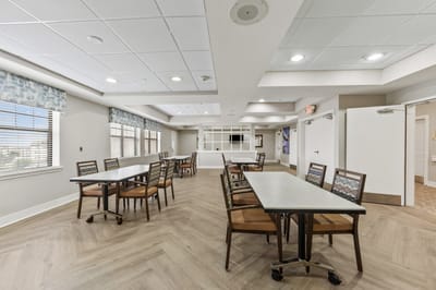 Bright common area with tables and chairs