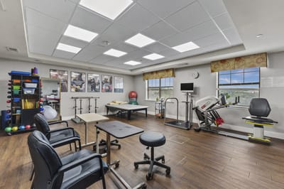 Bright rehabilitation gym with exercise equipment