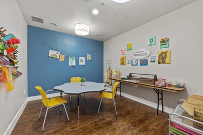 Bright craft room with tables and colorful decorations