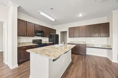 Spacious kitchen area with modern appliances