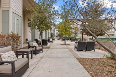 Pathway with seating in an outdoor area of the facility