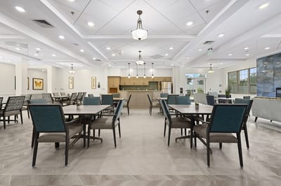 Dining room with tables and chairs around a central area