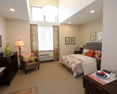 Well-decorated private resident room with bright decor