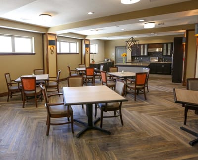 Bright dining area with tables and chairs