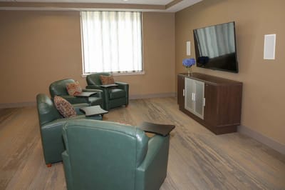 Cozy seating area with TV in common room