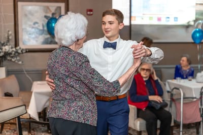 Residents enjoying a dance in a common area