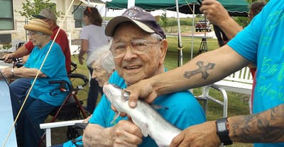 Residents enjoying fishing outdoors at the facility.