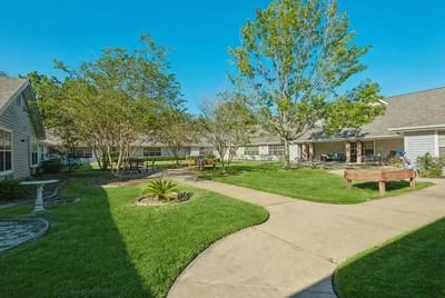 Well-maintained outdoor space with walking paths and greenery