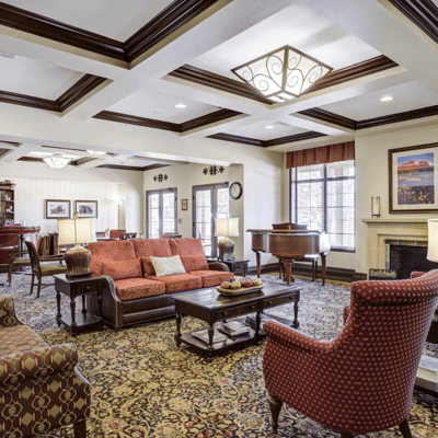 Cozy common area with comfortable seating and piano