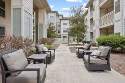 Outdoor seating area with chairs and pathways