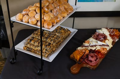 A display of pastries and charcuterie on trays