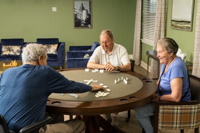 Residents playing a game in a common area