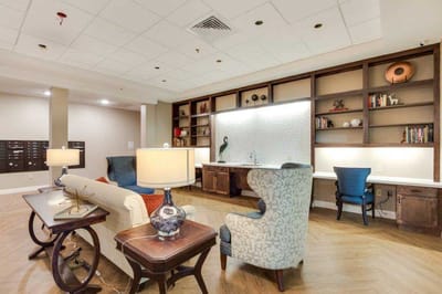 Stylish common area with seating and bookshelves