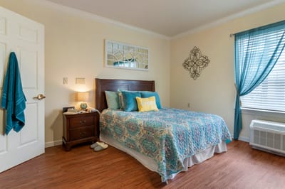 Cozy private resident room with a bed and decor