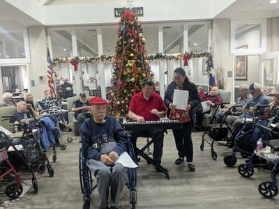 Residents enjoying a musical performance during a holiday event