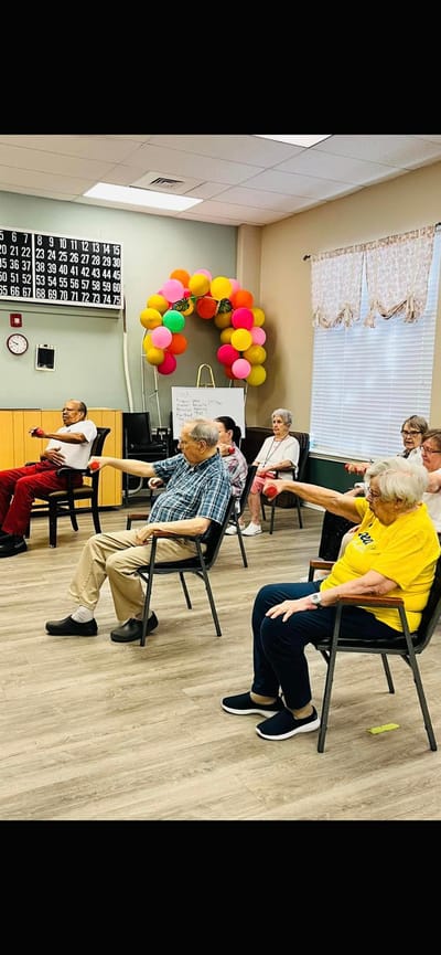 Residents participating in an activity session in a common area