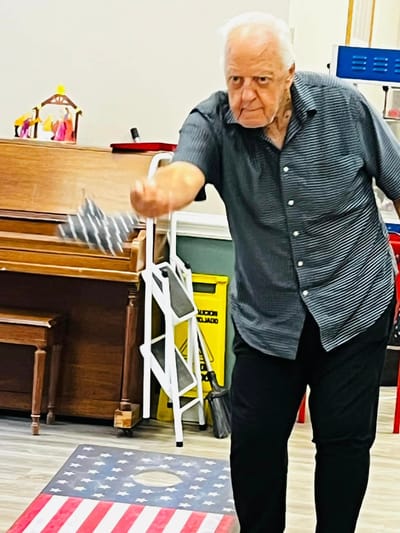 Resident enjoying a game indoors