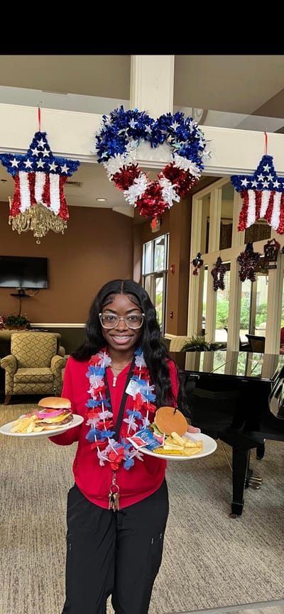 Staff member serving food with festive decorations