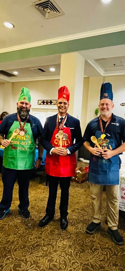 Staff members participating in a cooking competition