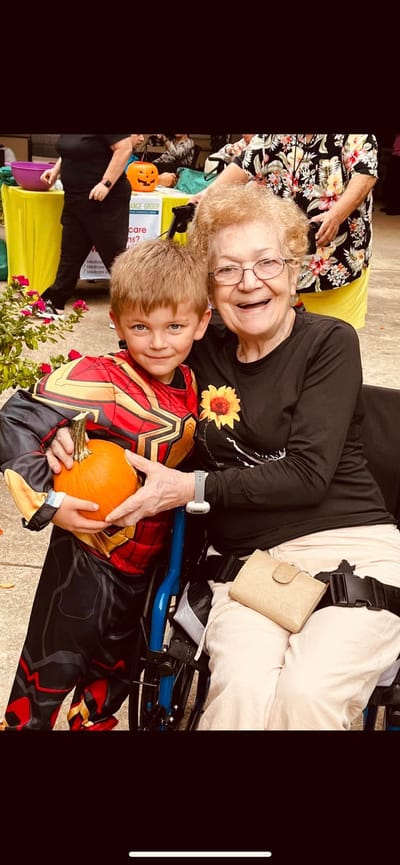 Resident with child during a festive activity