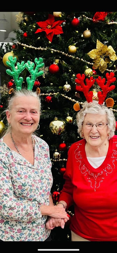 Residents celebrating together with festive headbands