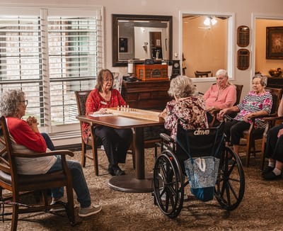 Residents engaged in an activity in a common room