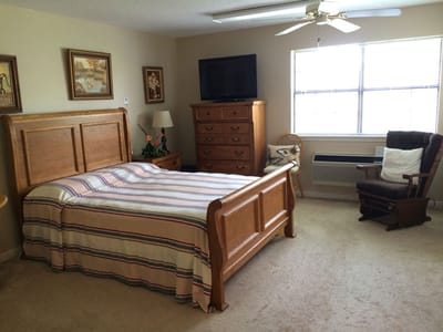 Comfortable resident room with a bed and furniture