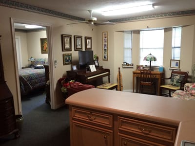 Cozy interior view of a resident room with a piano