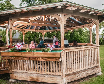 Residents enjoying a gazebo with outdoor seating