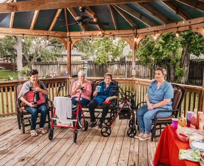 Residents enjoying a social gathering in a gazebo