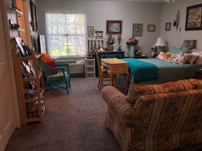 Cozy private room in a senior living facility with decor