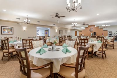 Dining room with tables set for a meal