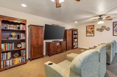 Interior view of a cozy common area with furniture and shelves