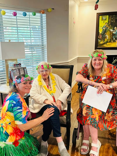 Residents and staff enjoying a themed celebration indoors