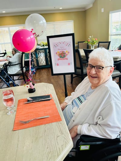 Resident celebrating a birthday in the dining room