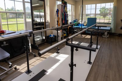 Interior rehabilitation space with parallel bars for therapy