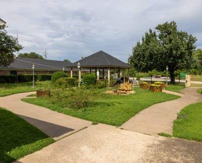 Outdoor garden area with gazebo and pathways