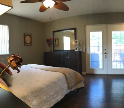 A cozy private room with a bed and natural light