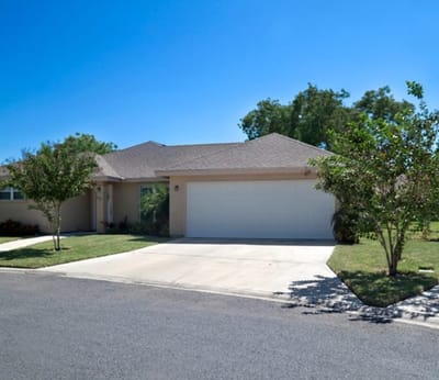 Exterior view of a residential building with landscaping