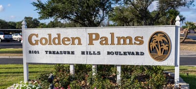 Signage for Golden Palms facility with landscaping