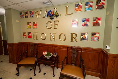 Wall of Honor featuring photos and flags