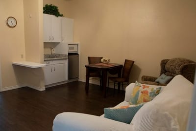 Cozy living area with kitchenette and dining table