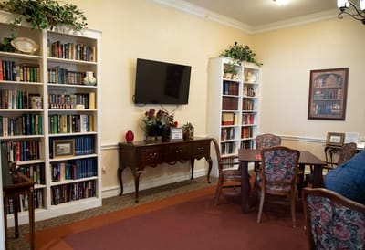Cozy common area with bookshelves and seating