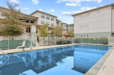 Outdoor pool area surrounded by the facility buildings